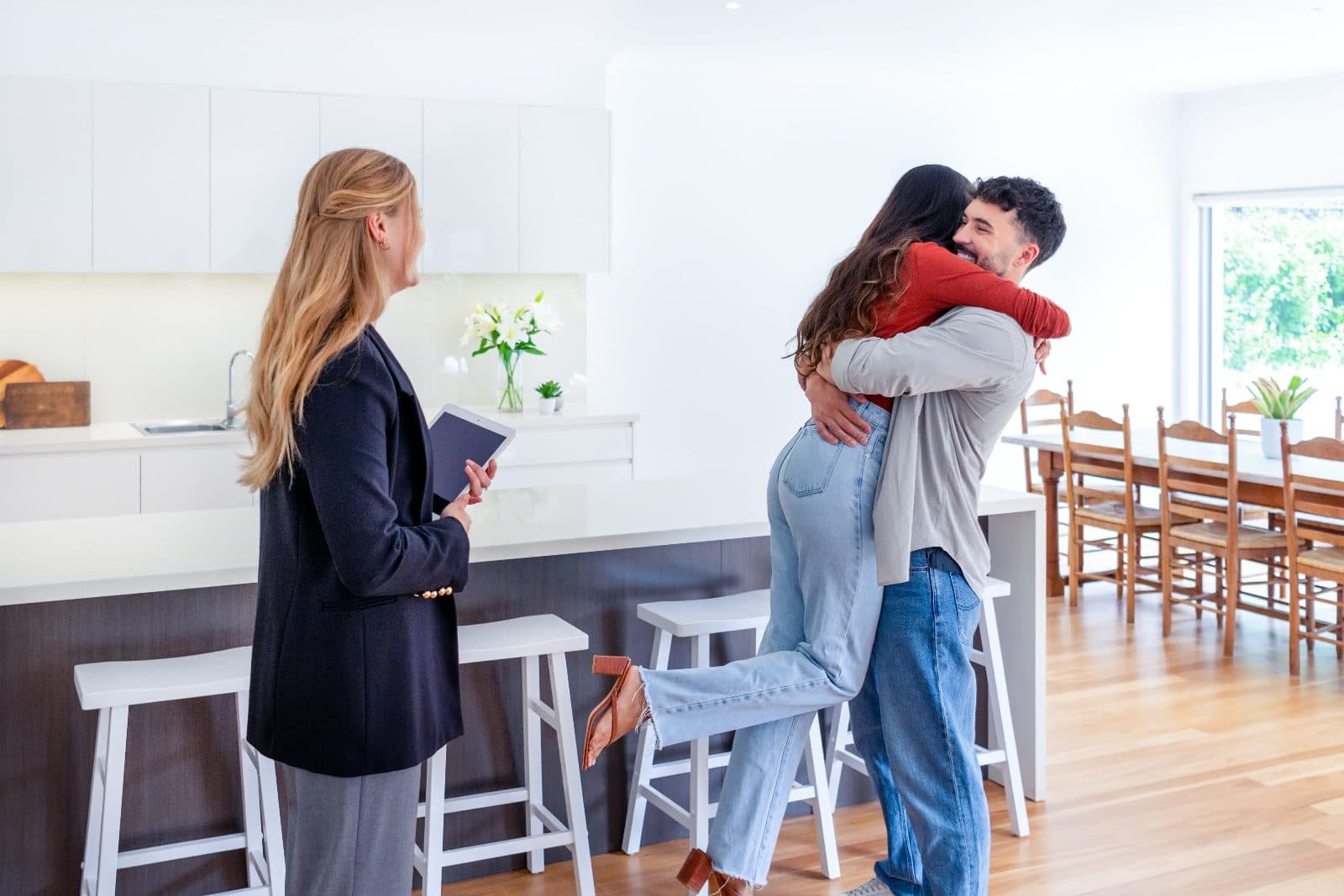 California couple celebrating their new home with their agent