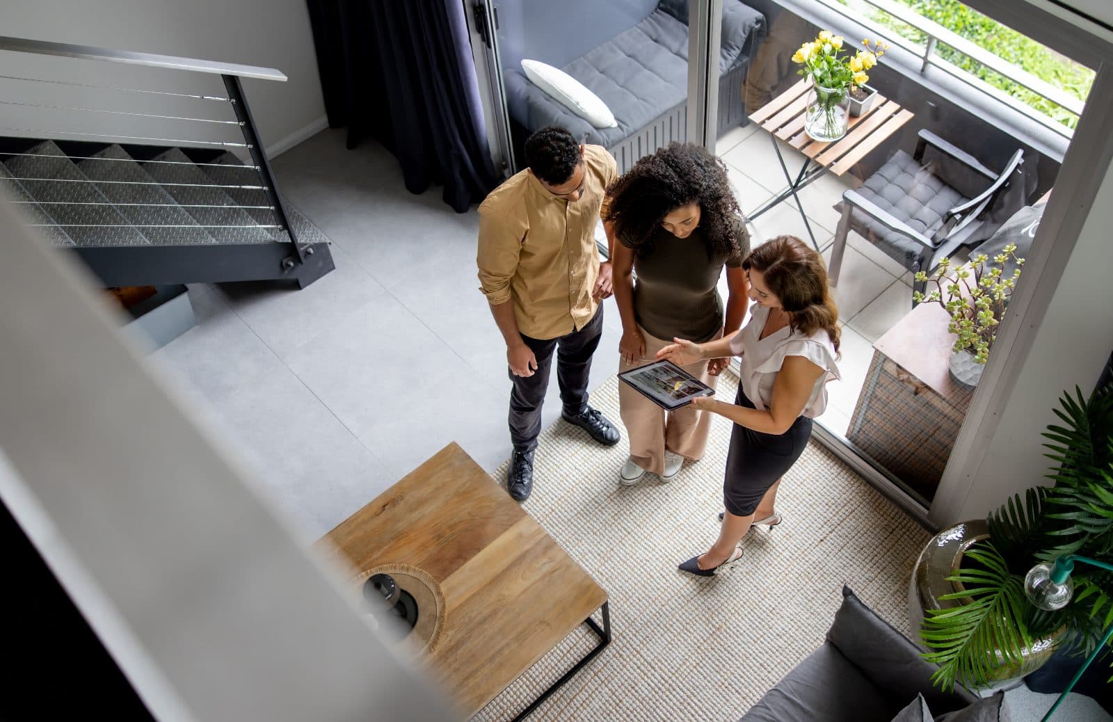 California couple comparing down payment options with a loan advisor