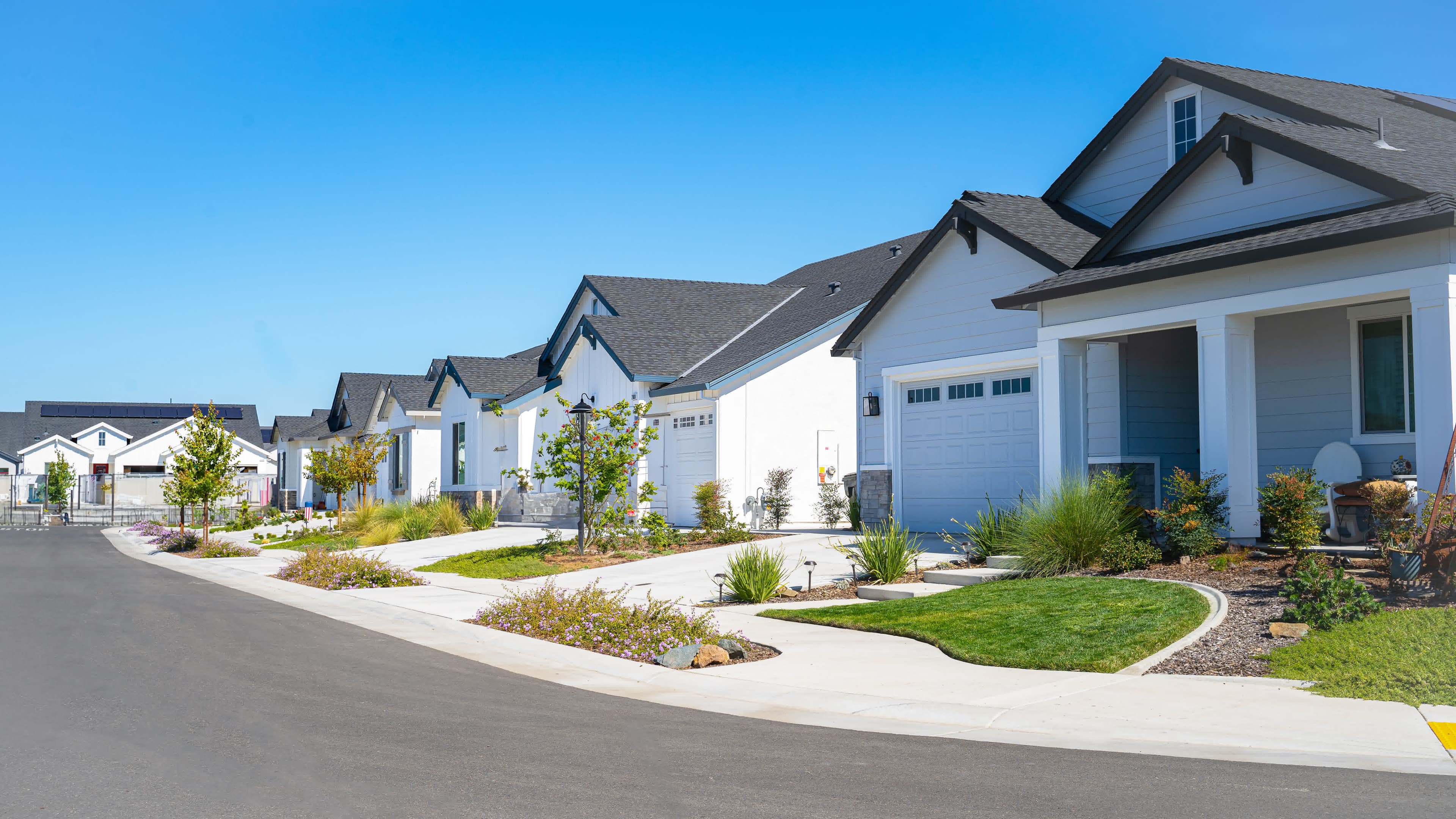 A row of newly built rental homes financed with DSCR investor loans