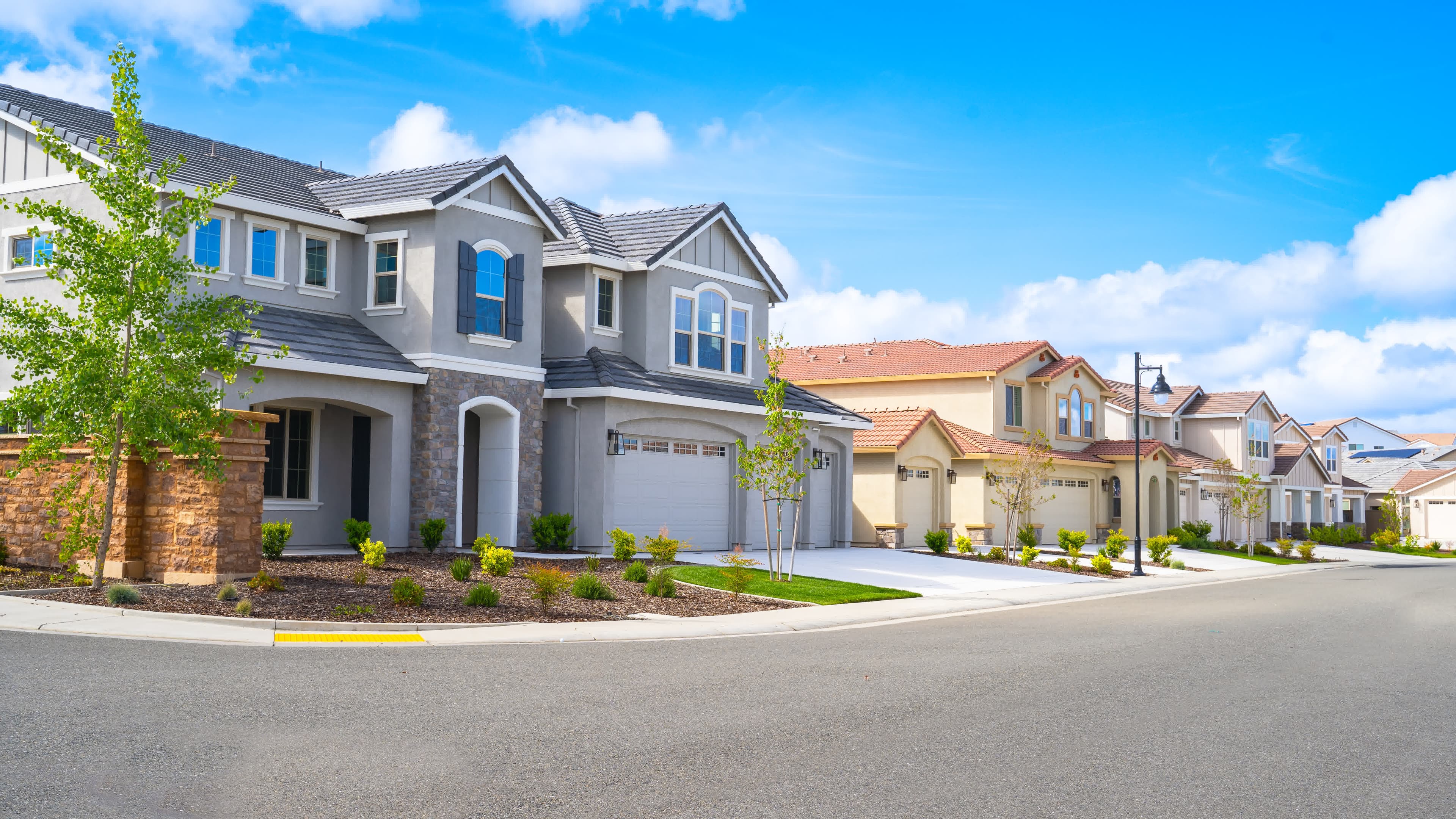 New two-story homes on a curved California street eligible for high-balance loans