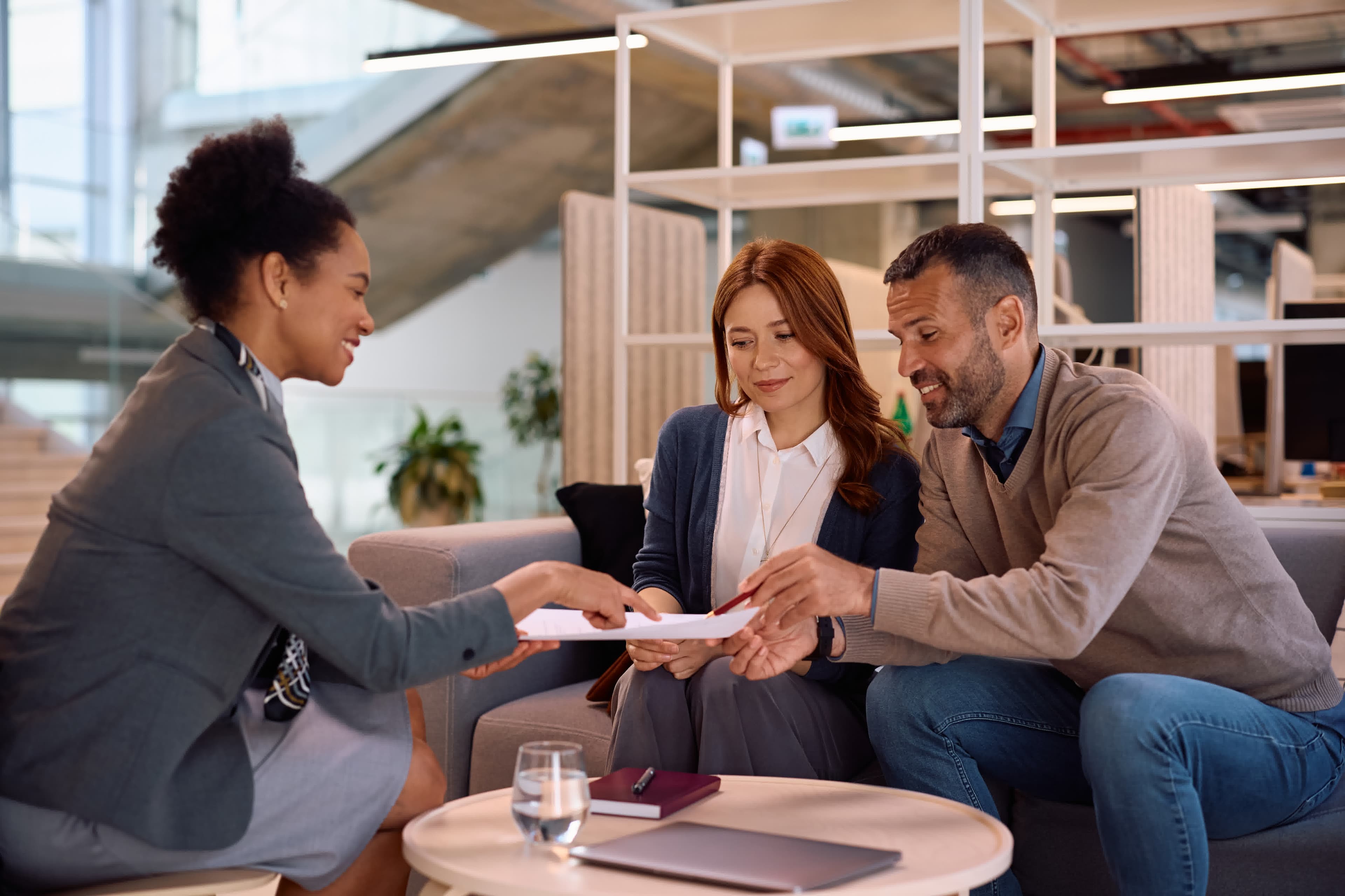 A couple meeting an advisor to add or remove a borrower from their mortgage