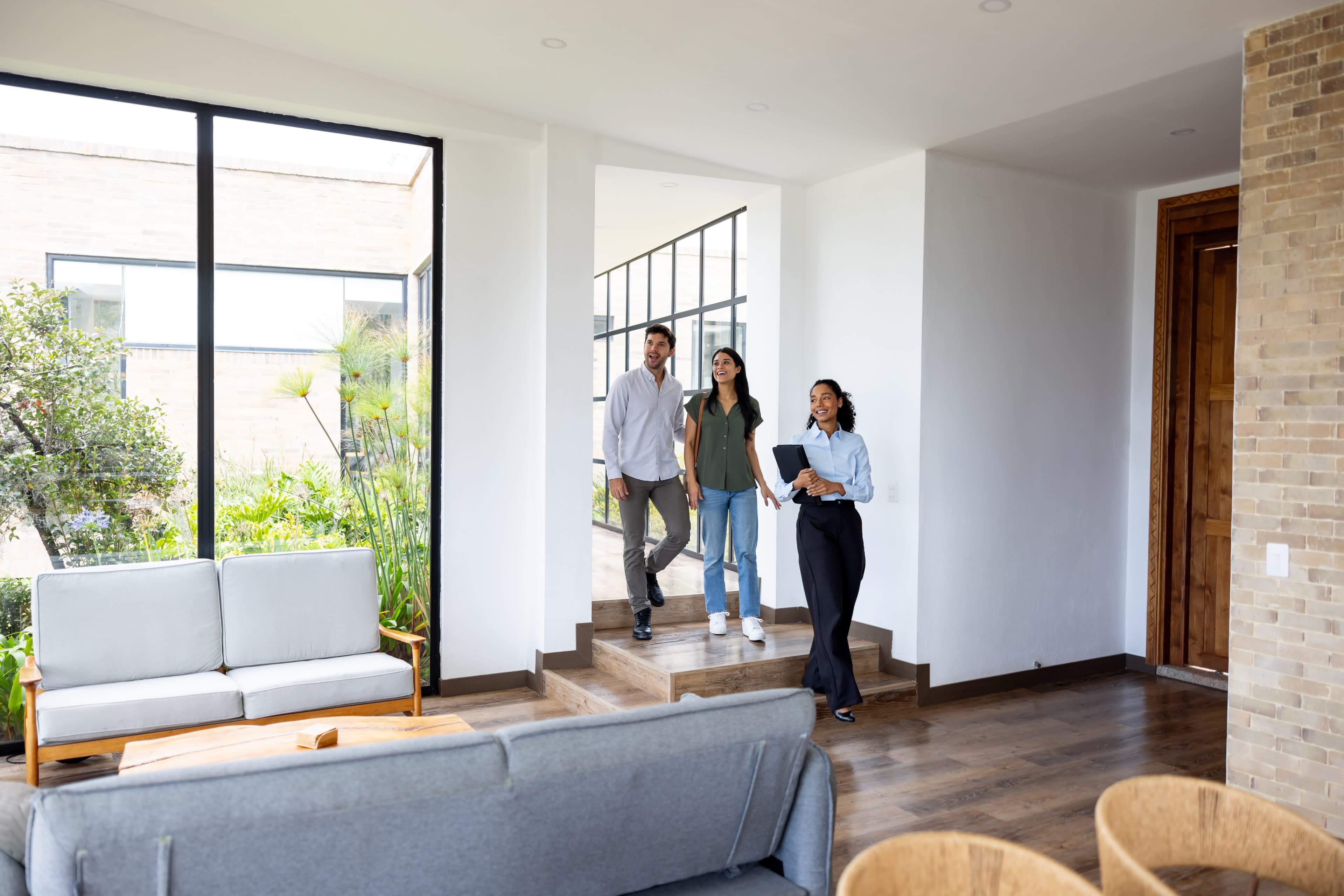 An advisor guiding a couple through mortgage hardship assistance options