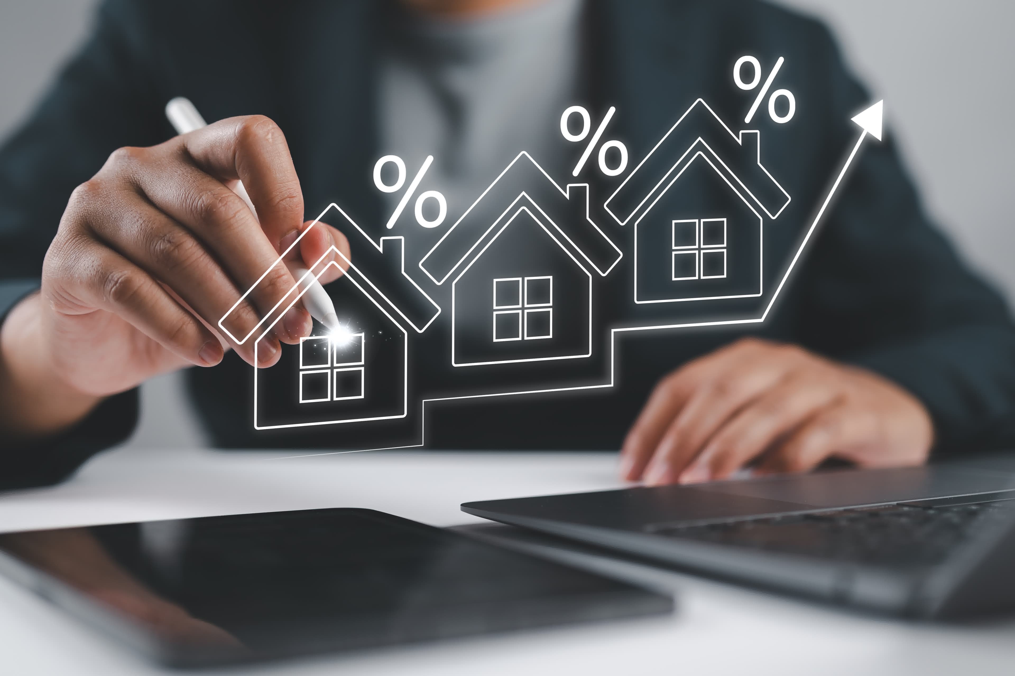 Rising house icons and percent symbols illustrating what moves mortgage rates