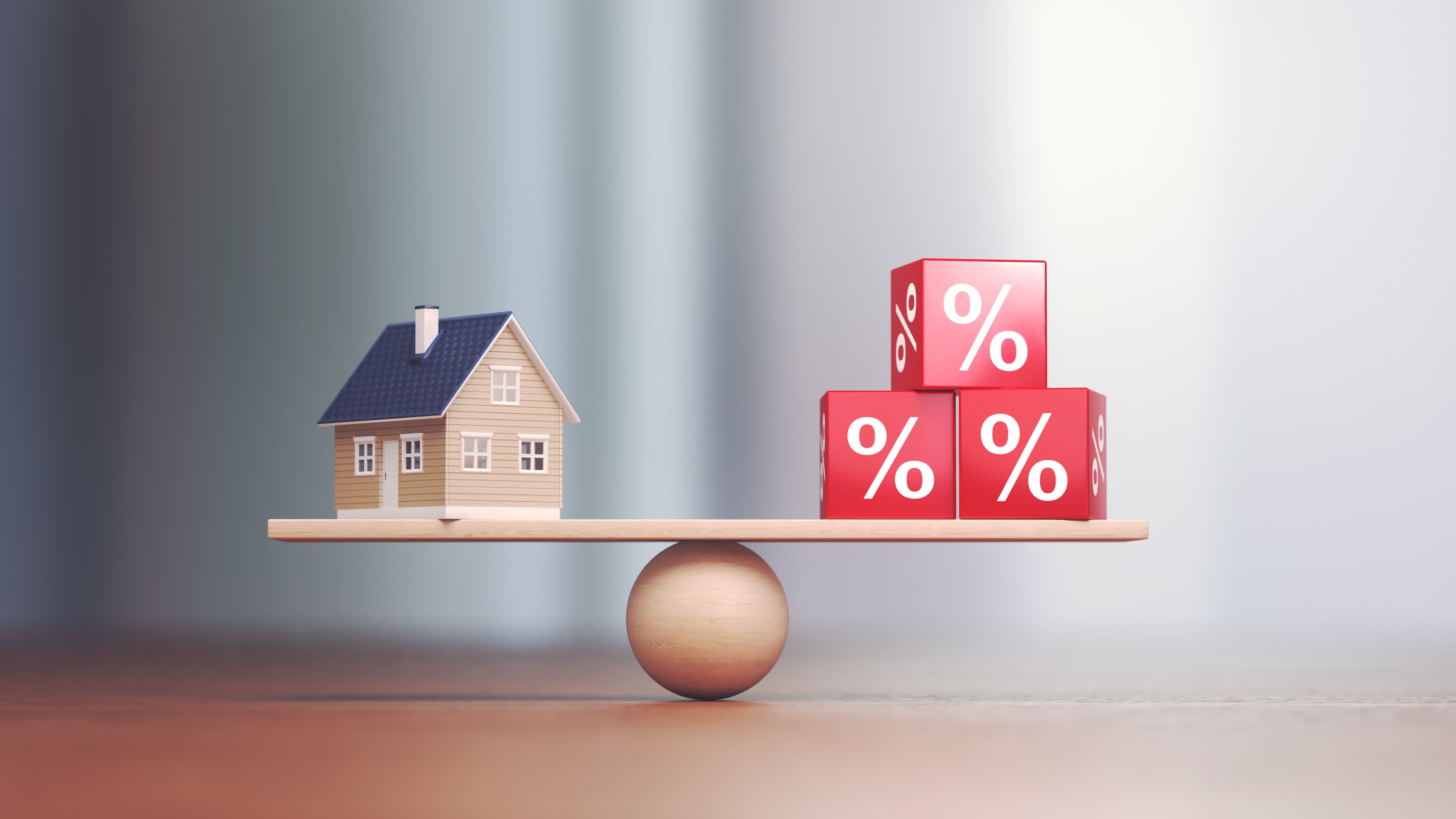 A model house balanced against percent blocks, symbolizing switching from an ARM to a fixed rate