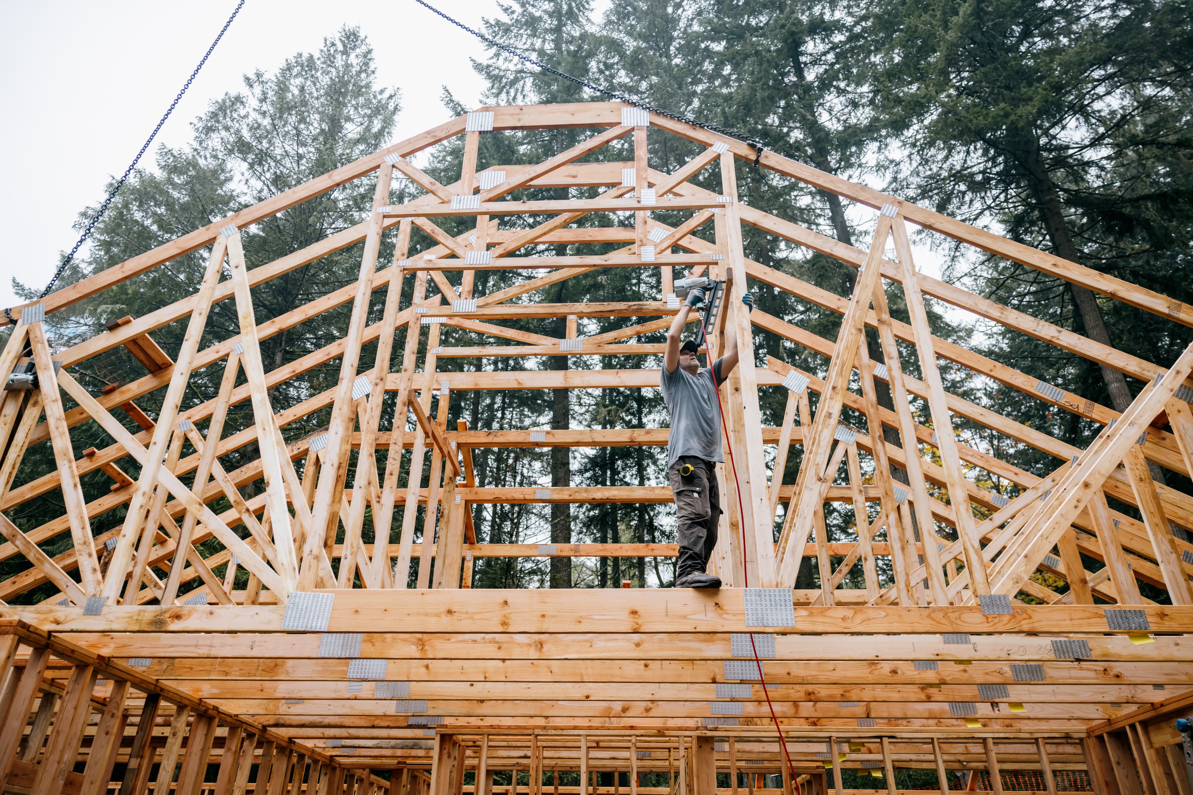 A construction worker framing a new California home financed with a construction loan